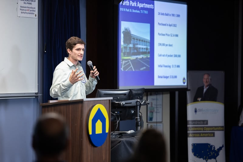 Man presenting to group of people