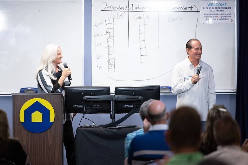 Two people teaching a class