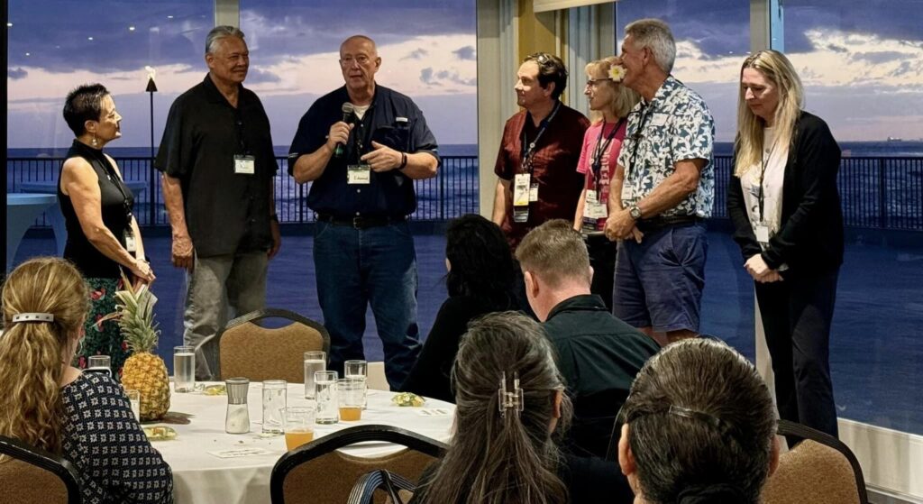 Group of people speaking at event